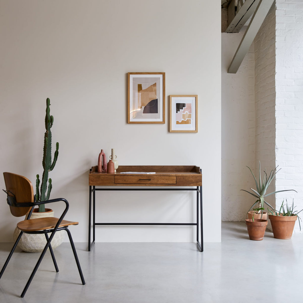 Tikamoon Hedda desk in solid mango and metal, angled view