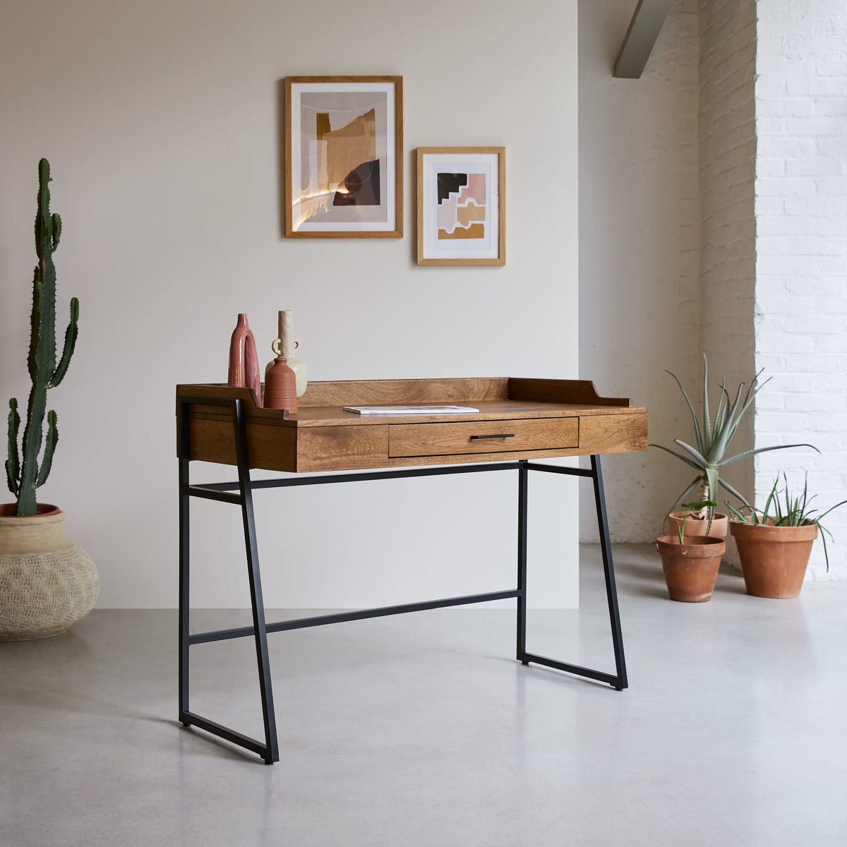 Tikamoon Hedda desk in solid mango and metal, three-quarter view