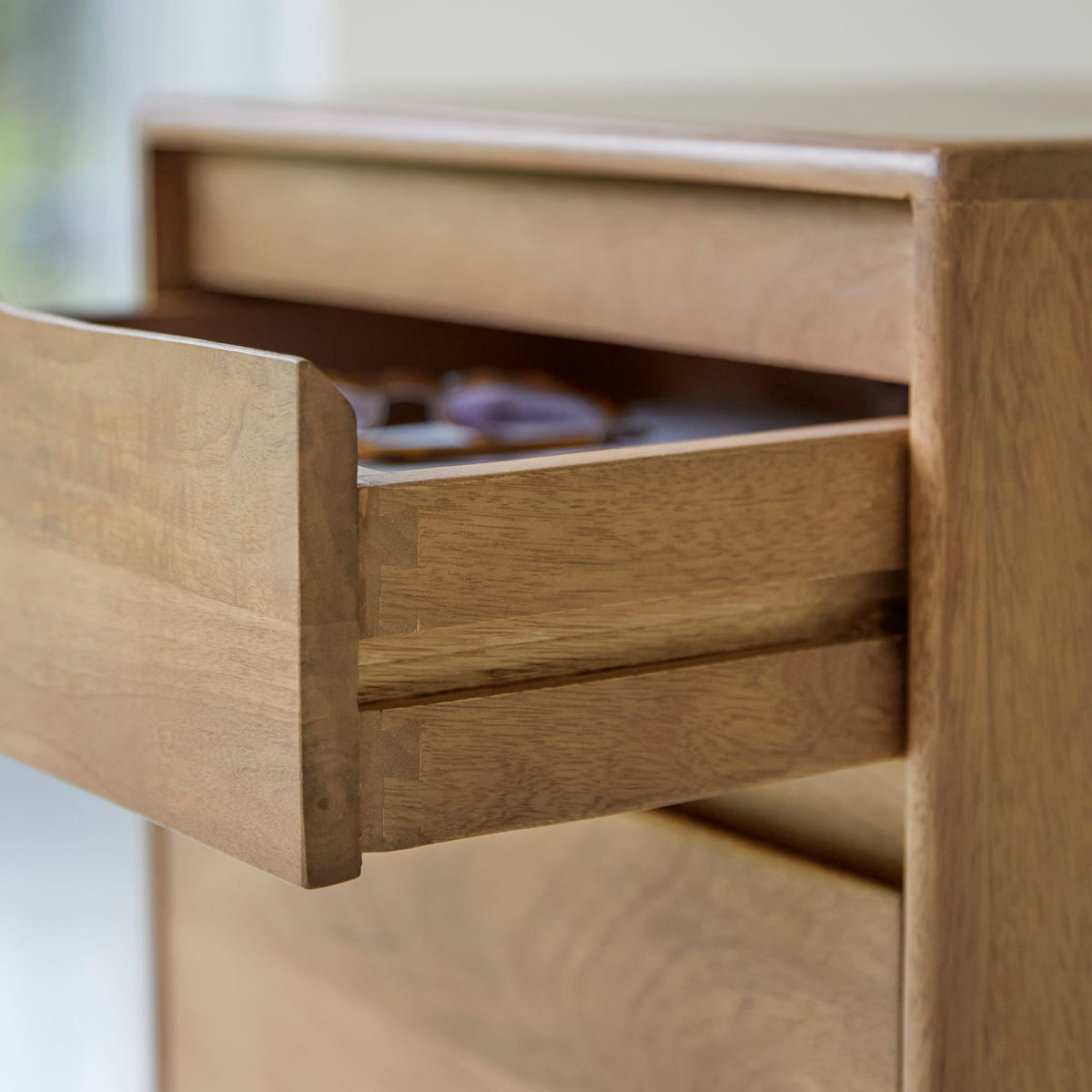 Tikamoon Gabrielle bedside table in solid mango, front view of the two drawers