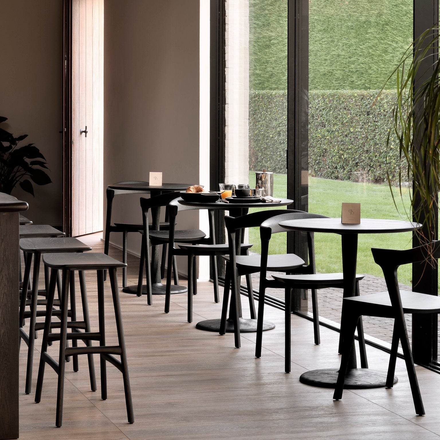 Ethnicraft Torsion Square Dining Table styled in a dining room