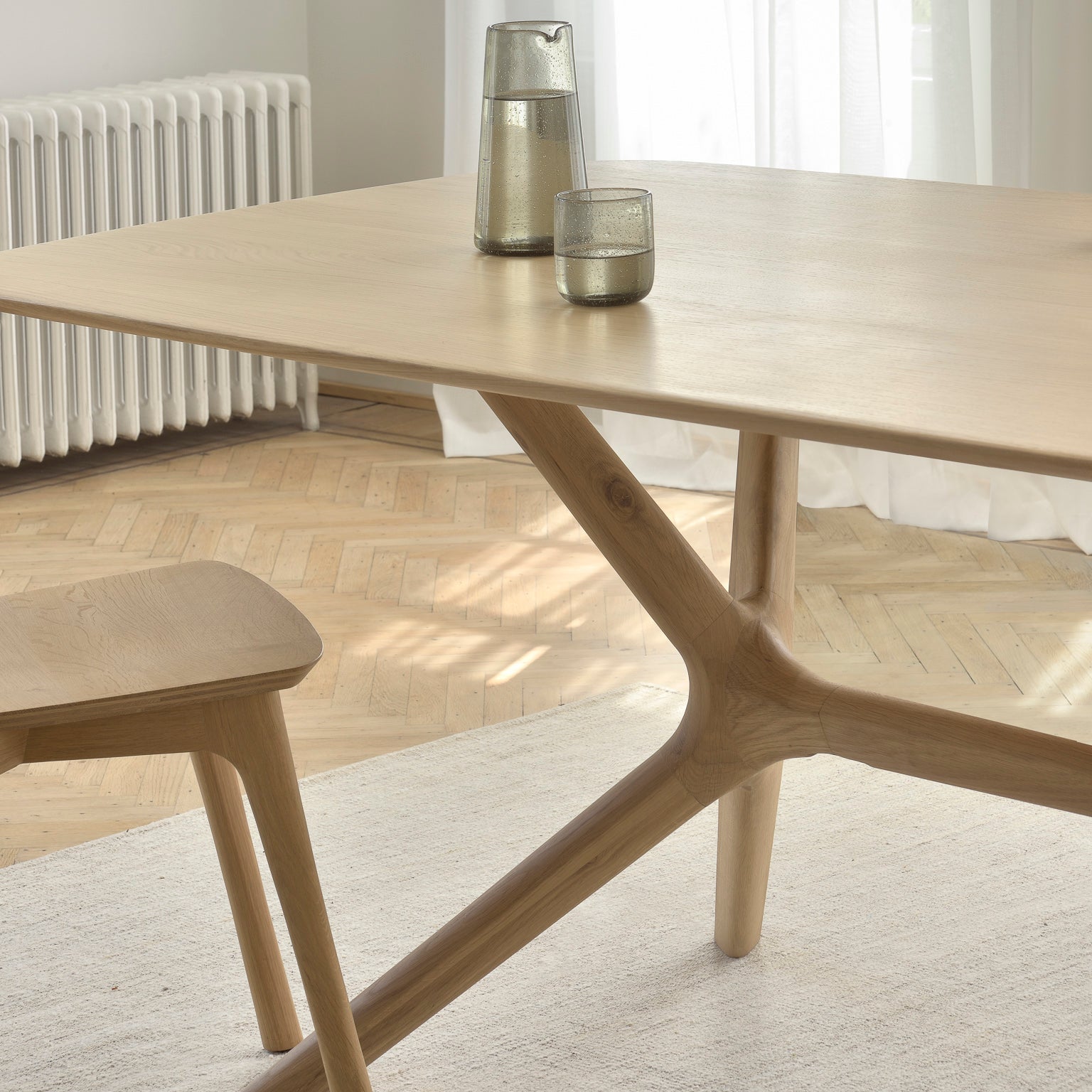 Ethnicraft X Dining Table in oak styled in a dining room