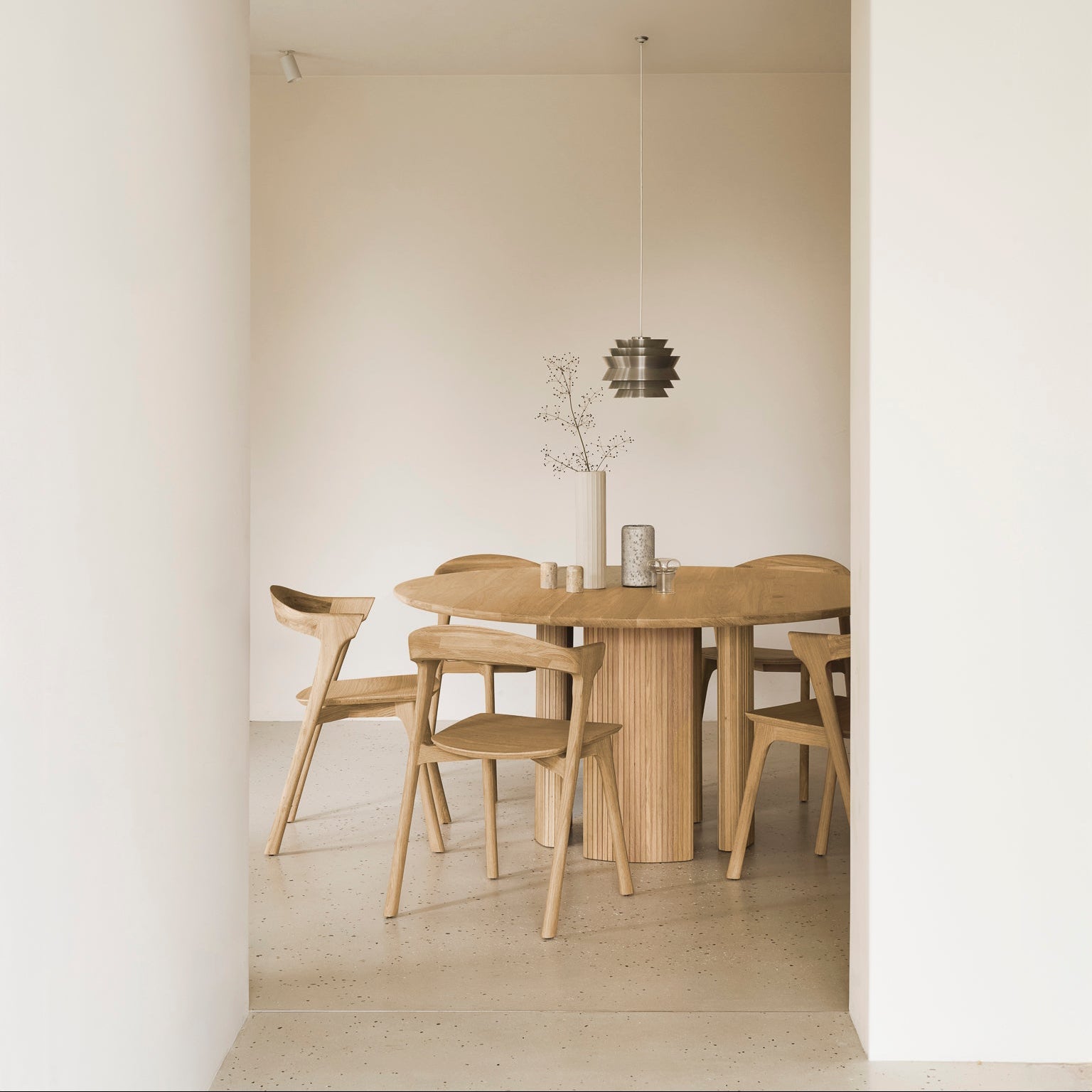 Ethnicraft Roller Max Dining Table in oak styled in a dining room