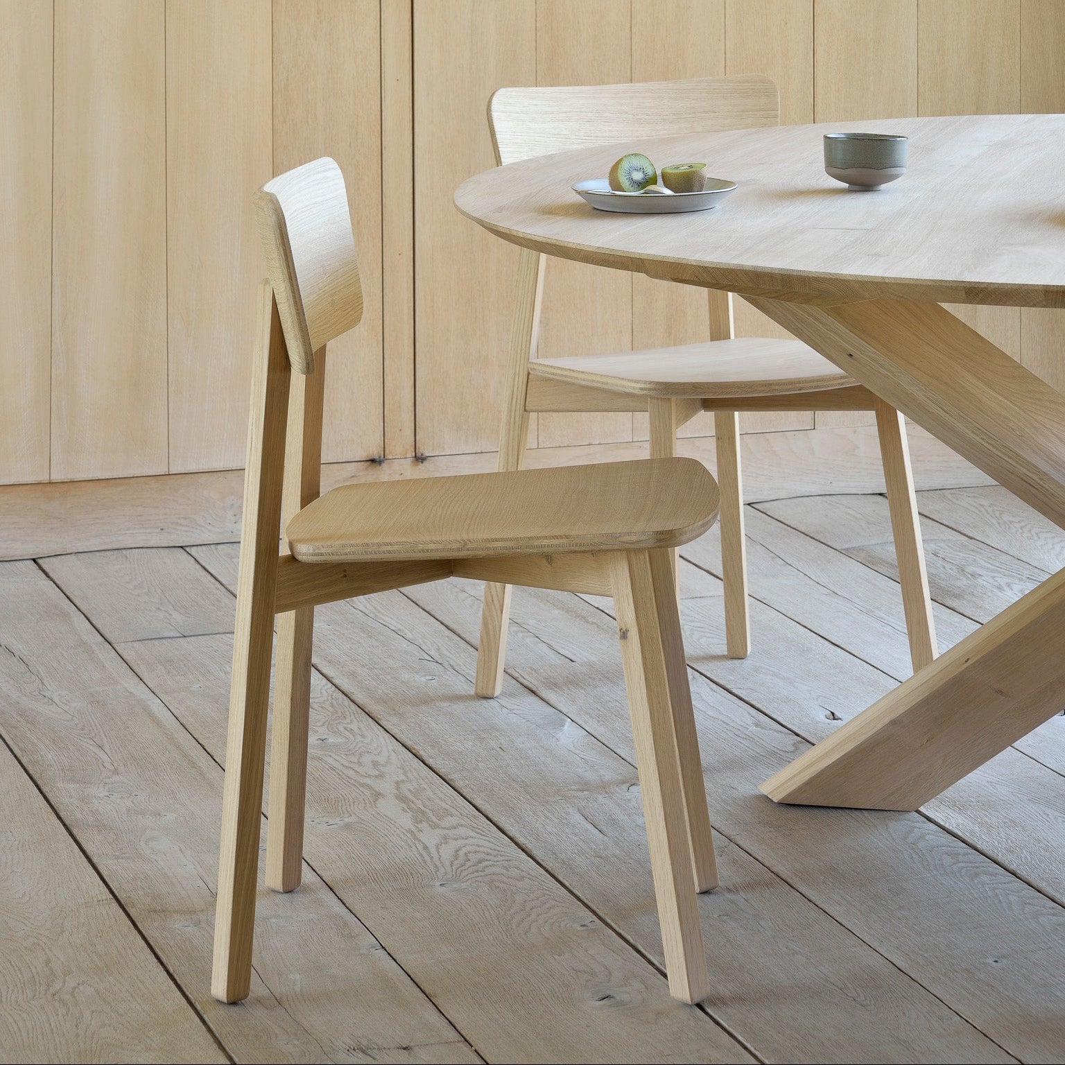 Ethnicraft Casale Dining Chair in oak styled in a dining room