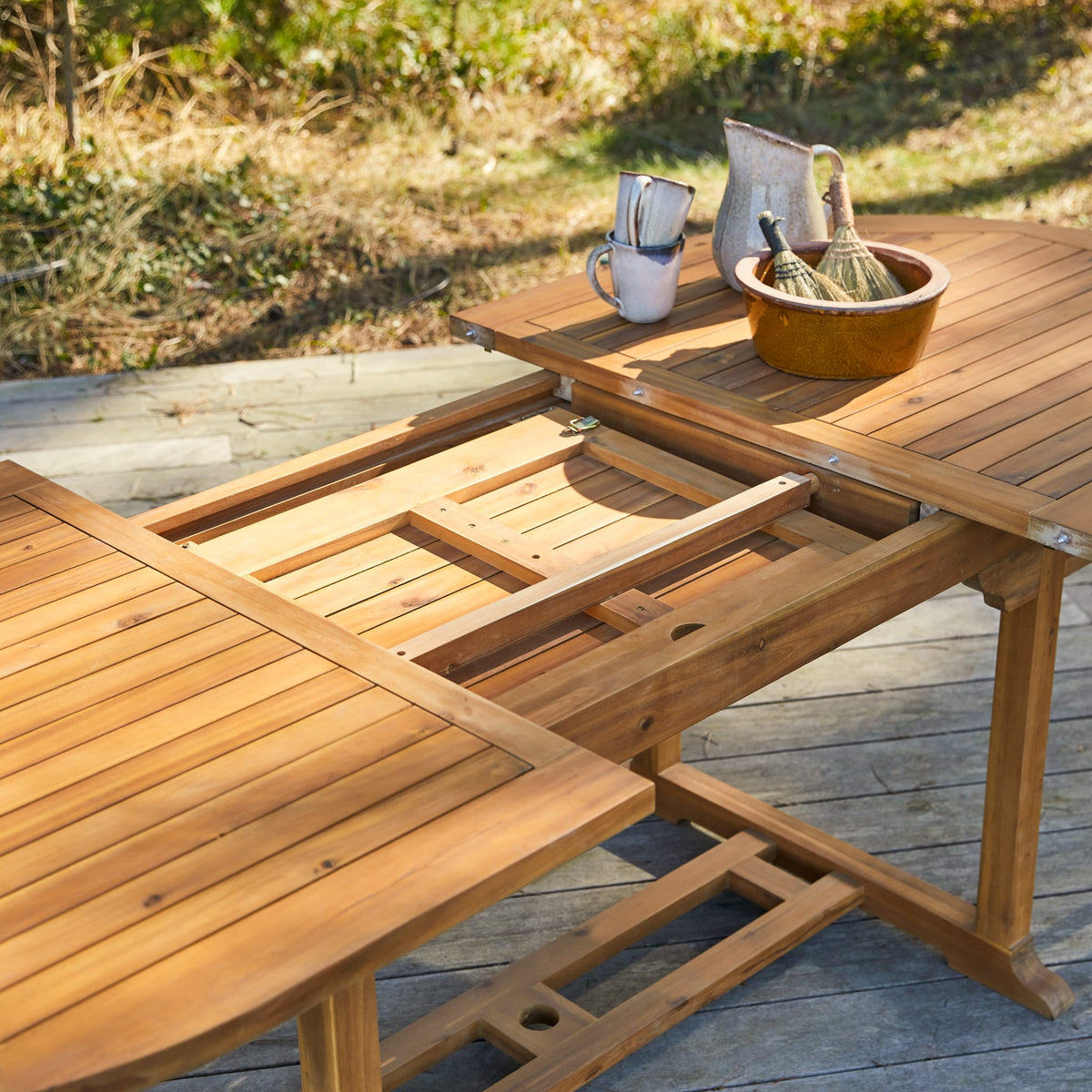 Tikamoon Capri oval extending garden table in solid acacia, front view