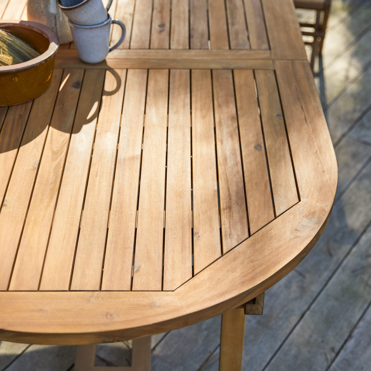 Tikamoon Capri oval acacia table, close-up of the slatted top