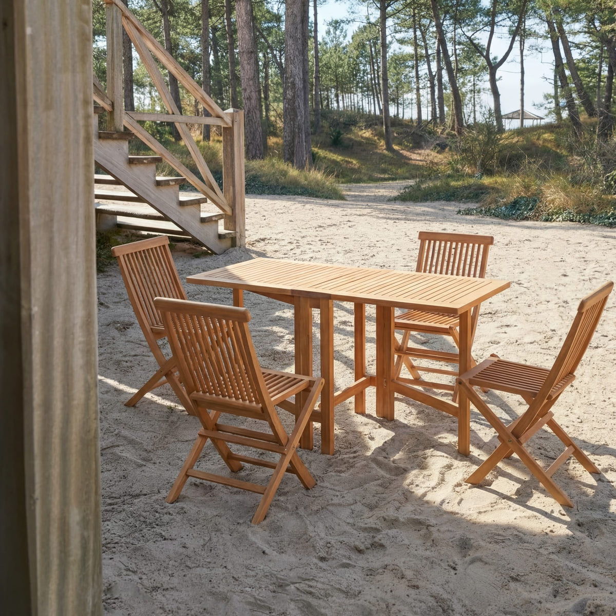 Tikamoon Capri folding garden dining set in solid acacia, angled view of the table and four chairs