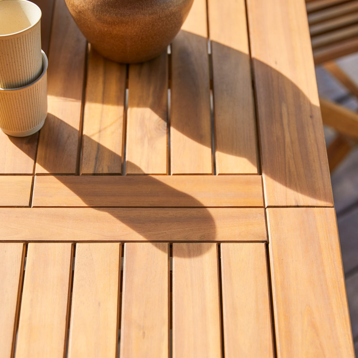 Tikamoon Capri acacia folding table, top view with the extension closed