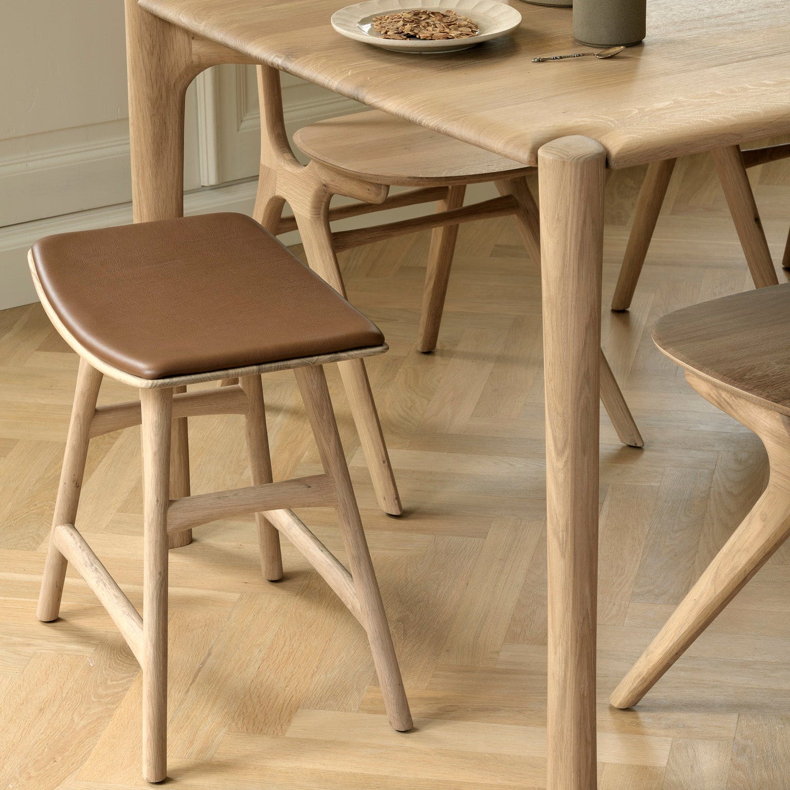 Ethnicraft Osso Stool styled in a dining room