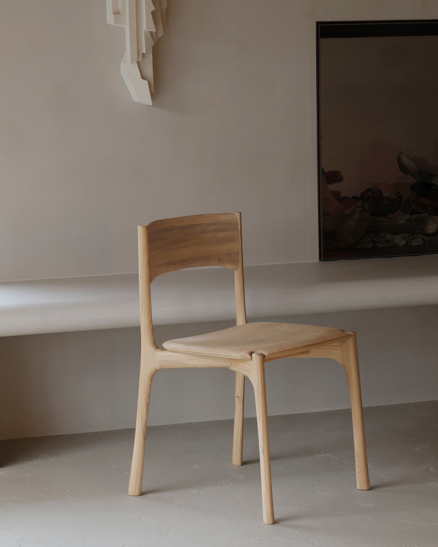 Ethnicraft Pi Dining Chair in oak styled in a dining room
