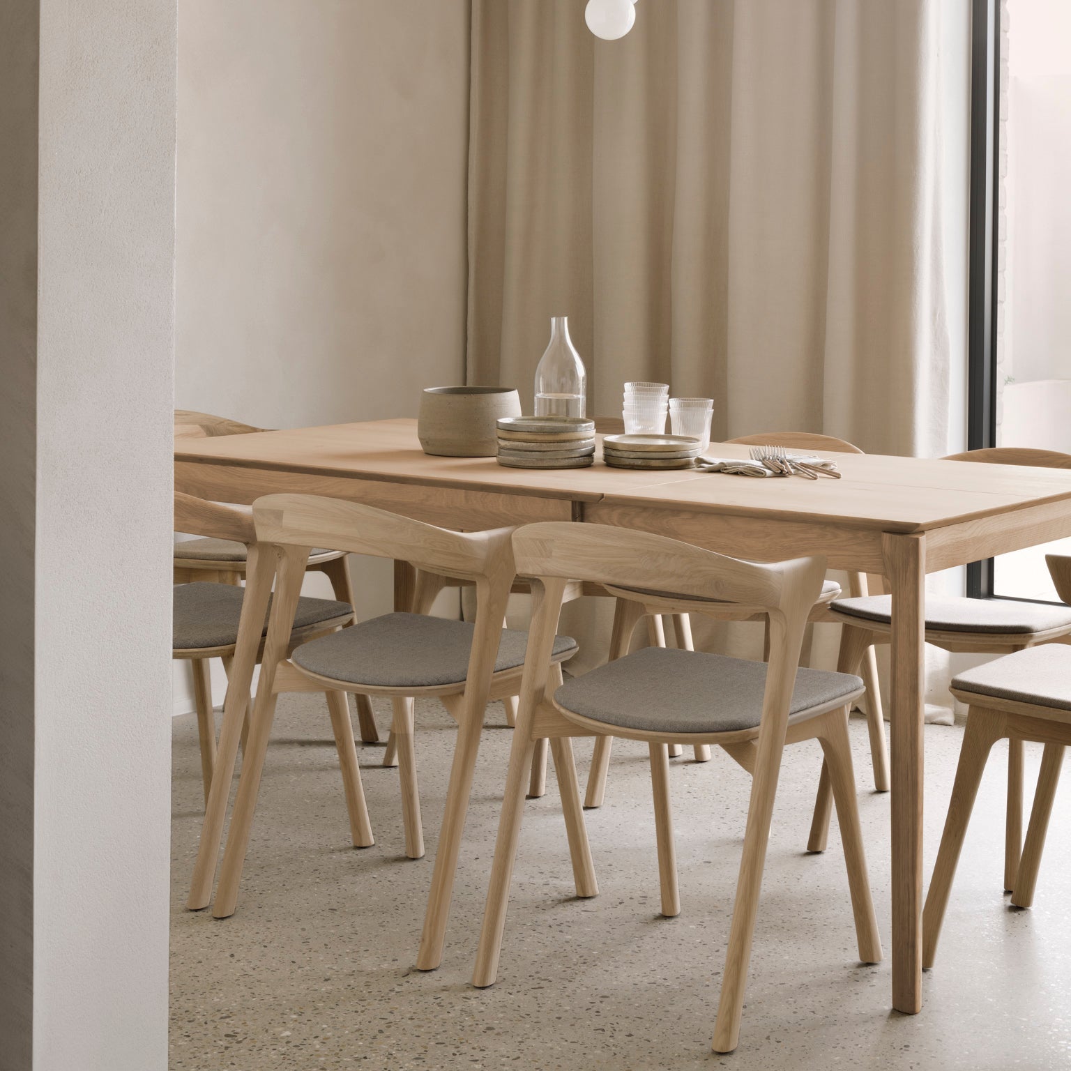Ethnicraft Bok Extendable Dining Table in oak styled in a dining room