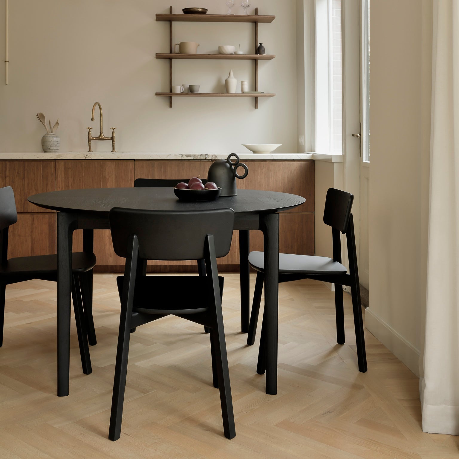 Ethnicraft Bok Extendable Dining Table styled in a dining room