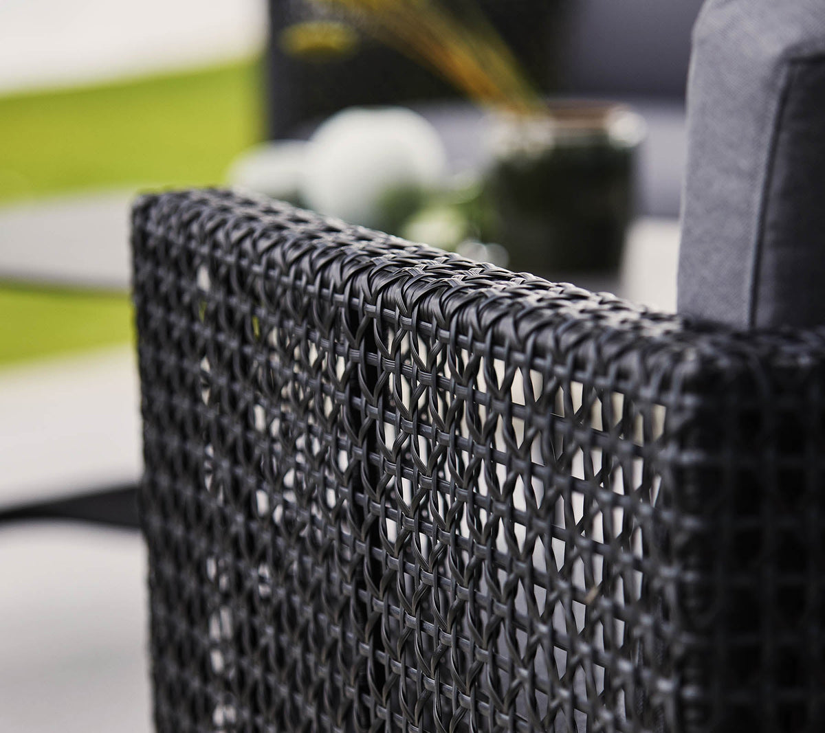 Detail of Cane-line Connect Lounge Chair showing the Black/Graphite small cross peel polyethylene Weave