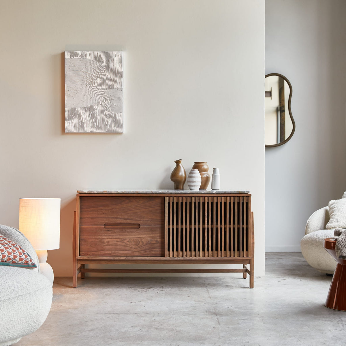 Tikamoon Isaure sideboard in solid walnut with terrazzo top, angled view