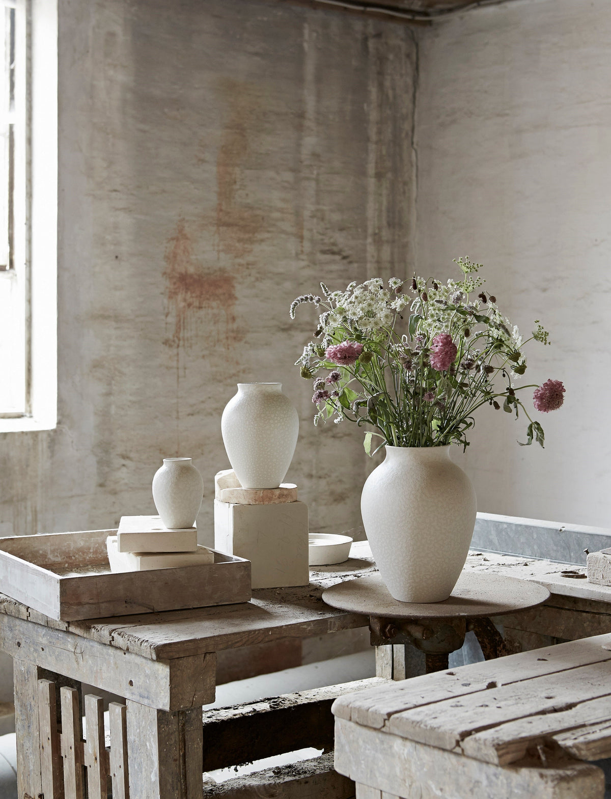 Knabstrup Vase in white, styled in an interior setting, glazed earthenware