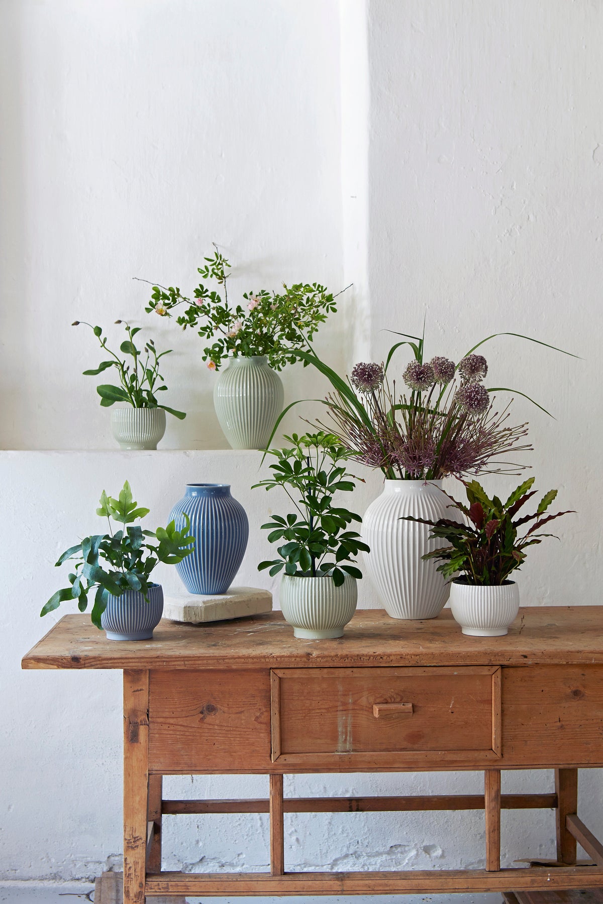 Knabstrup ripple flowerpots in several glazes, styled in an interior setting, glazed earthenware