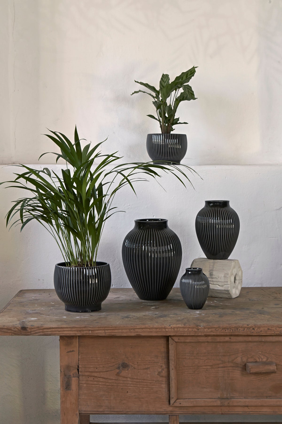 Knabstrup ripple flowerpots in several glazes, styled in an interior setting, glazed earthenware