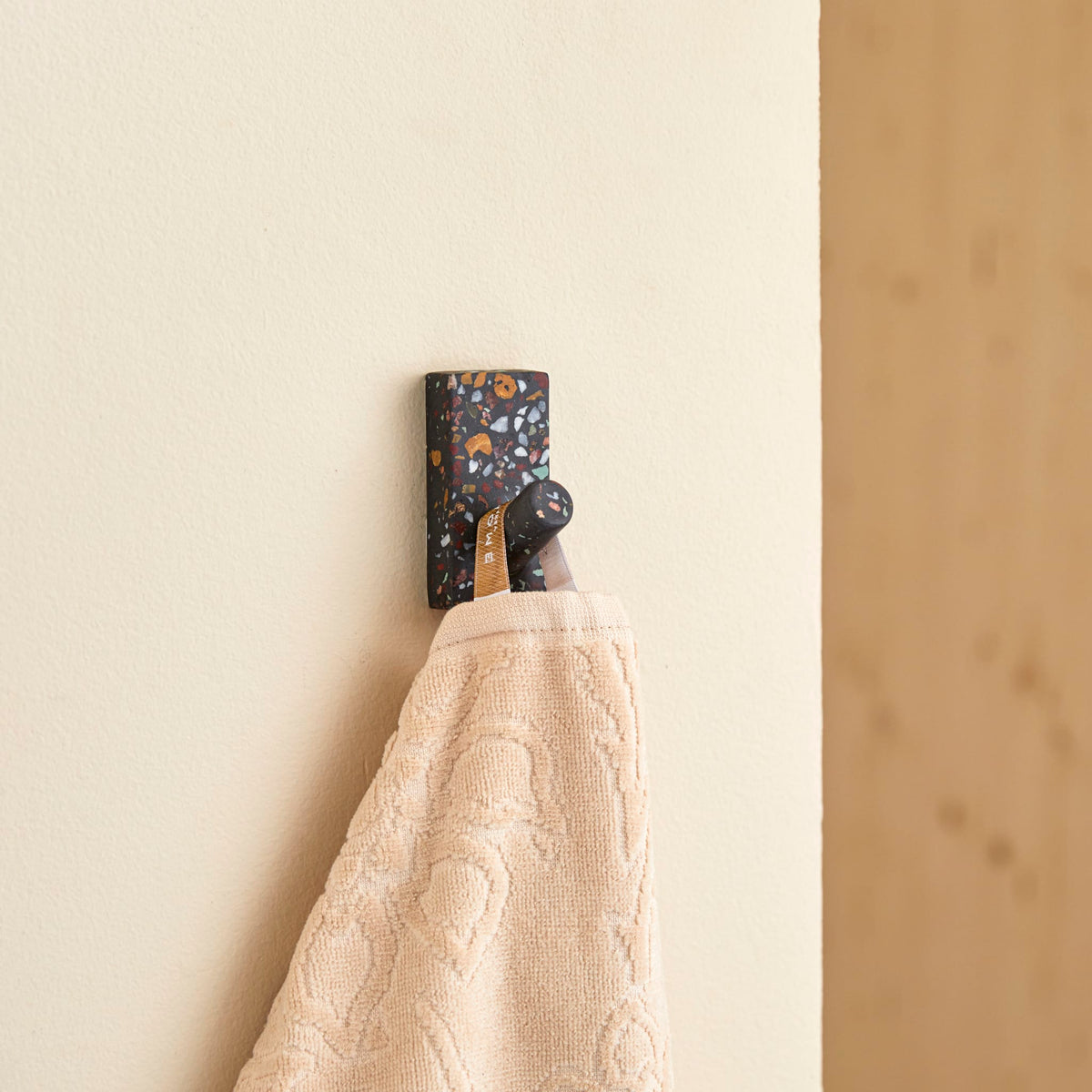 Tikamoon Sara confetti terrazzo coat hook, side view showing the projection