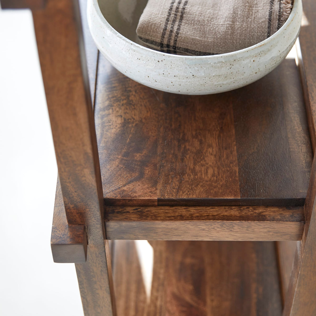 Tikamoon Arko dark mango bookcase, detail of the openwork frame