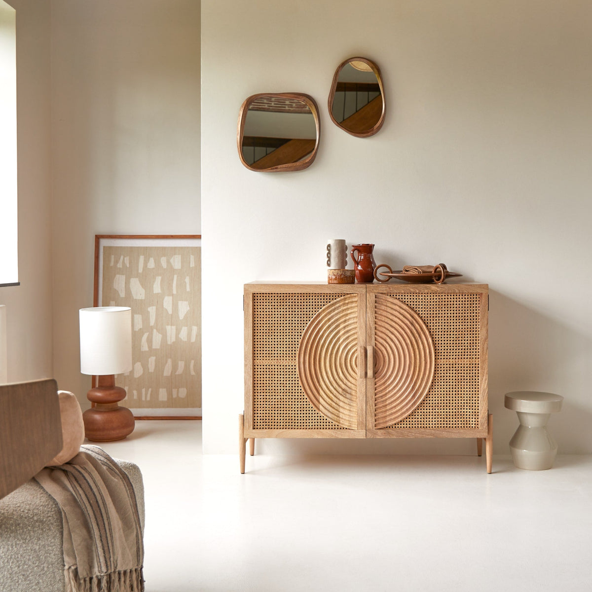 Tikamoon Sina sideboard in solid mango and rattan, angled view