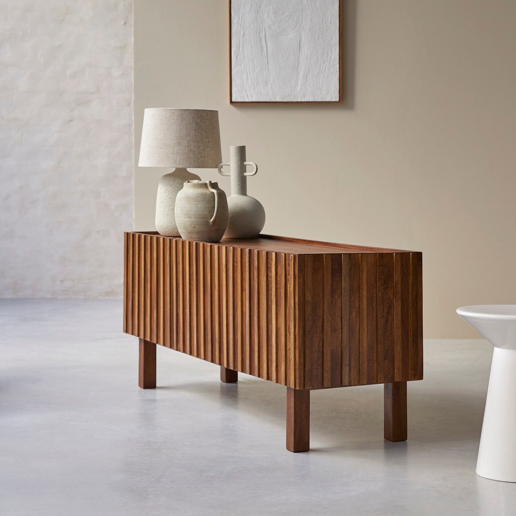 Tikamoon Milo TV stand in solid mango wood, three-quarter view