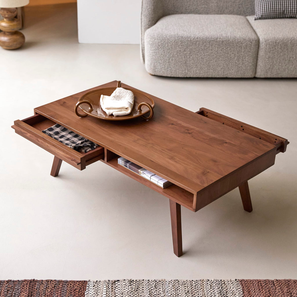 Tikamoon Niels acacia coffee table, side view showing the angled legs