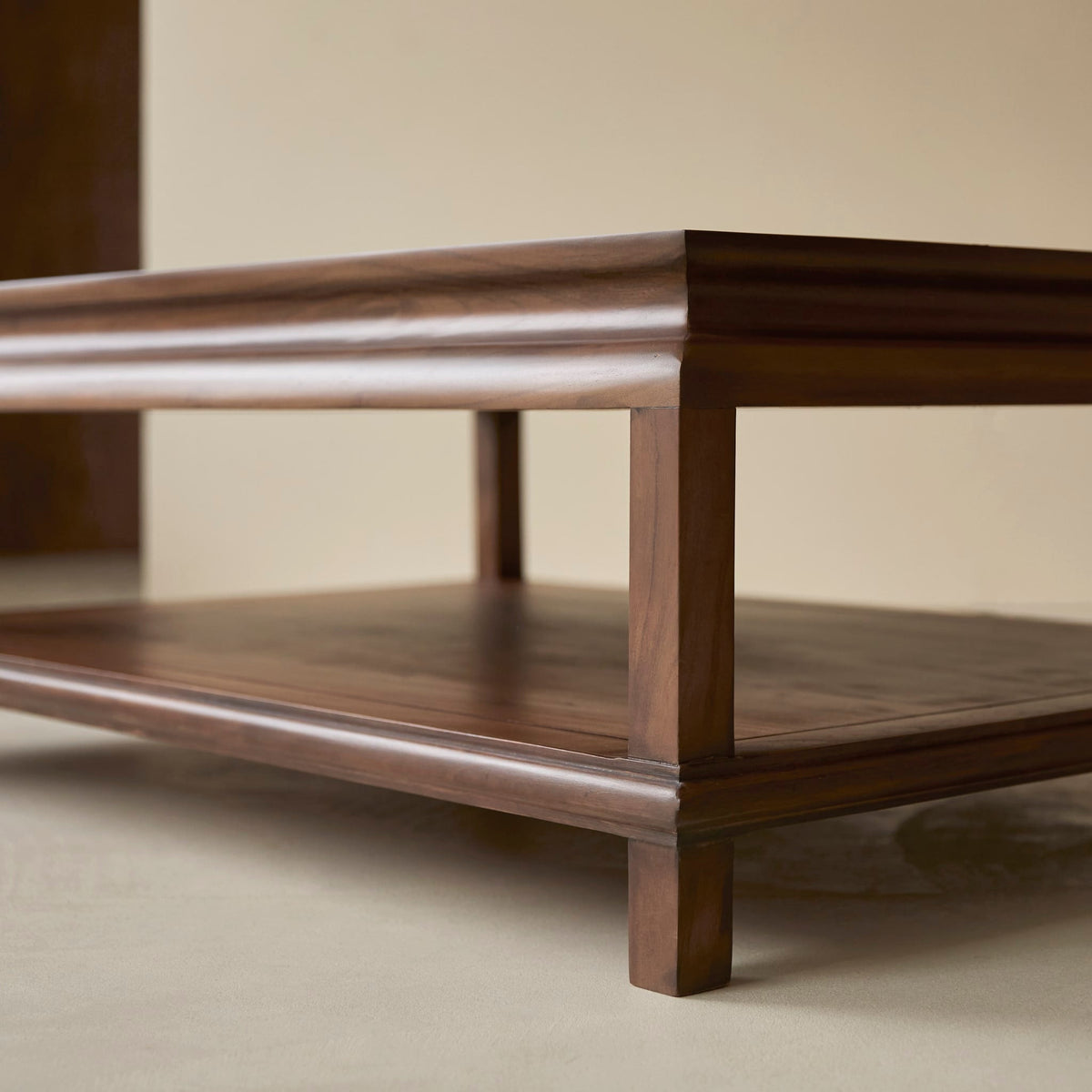 Detail of the Achille coffee table leg and shelf moulding