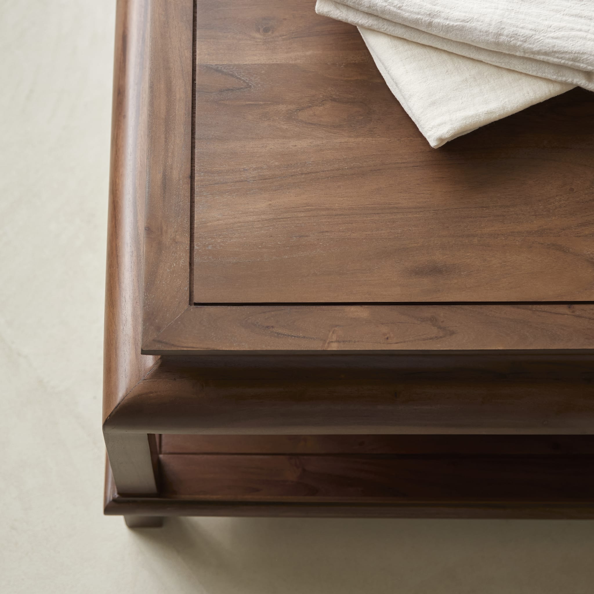 Achille acacia coffee table, side angle showing lower shelf