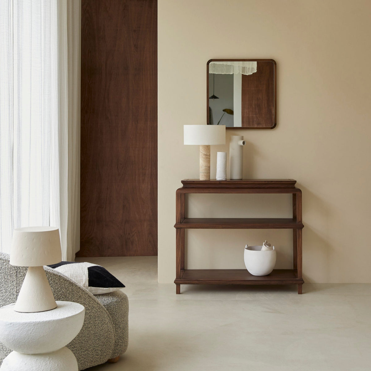 Tikamoon Achille solid acacia console table under a wall mirror