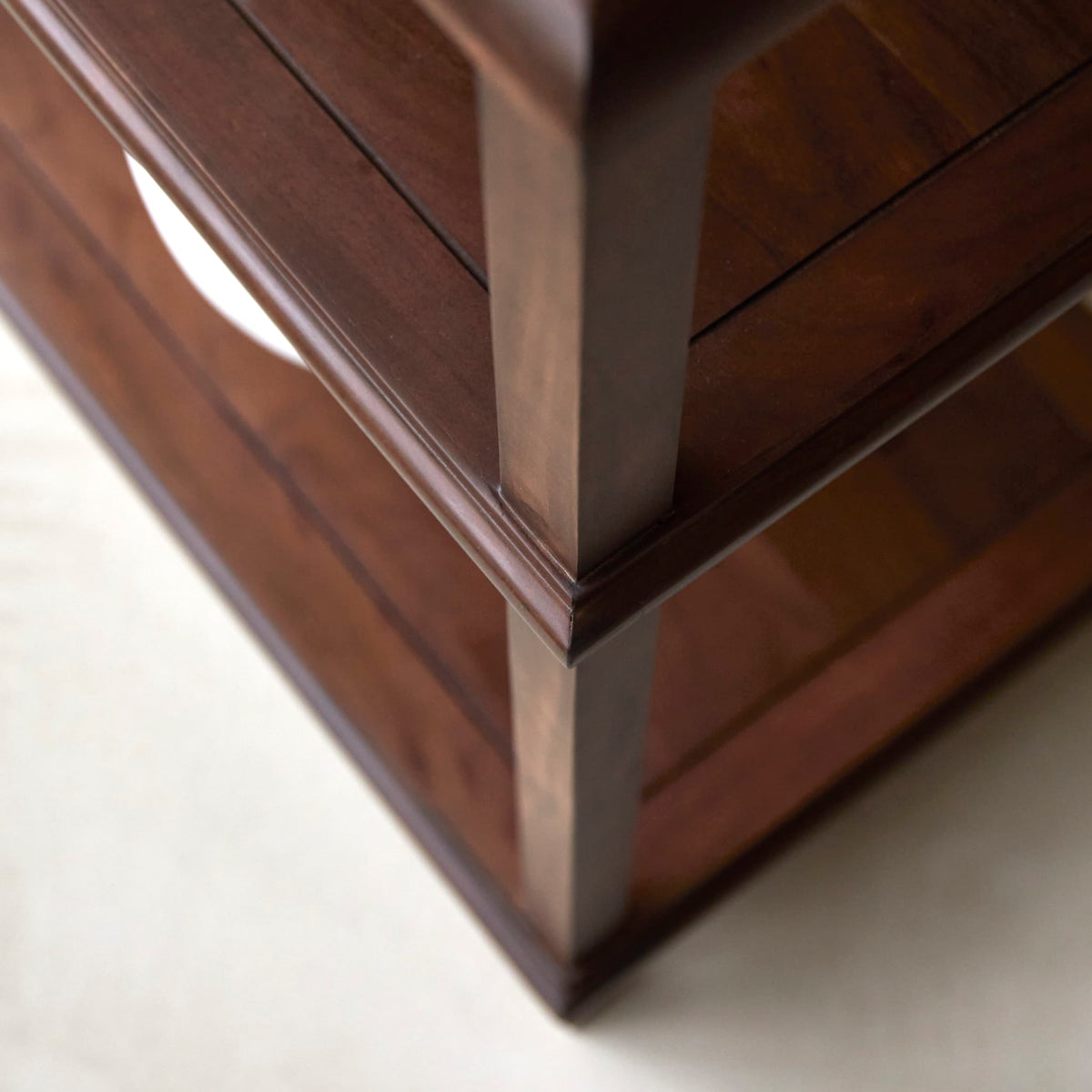 Close-up of the Achille console leg and shelf moulding