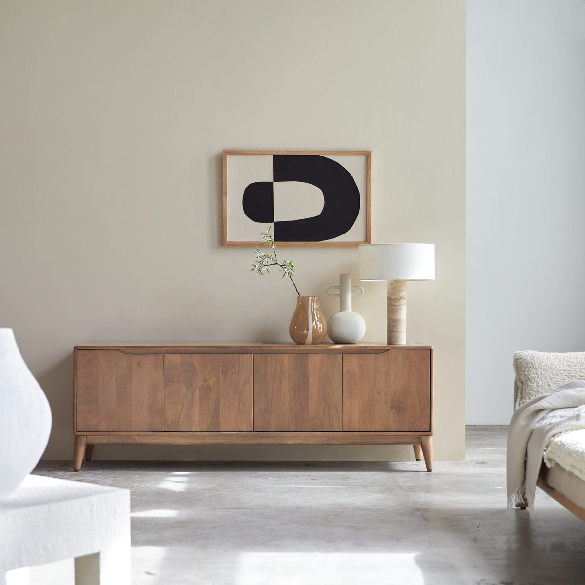 Tikamoon Gabrielle TV stand in solid mango wood, angled view