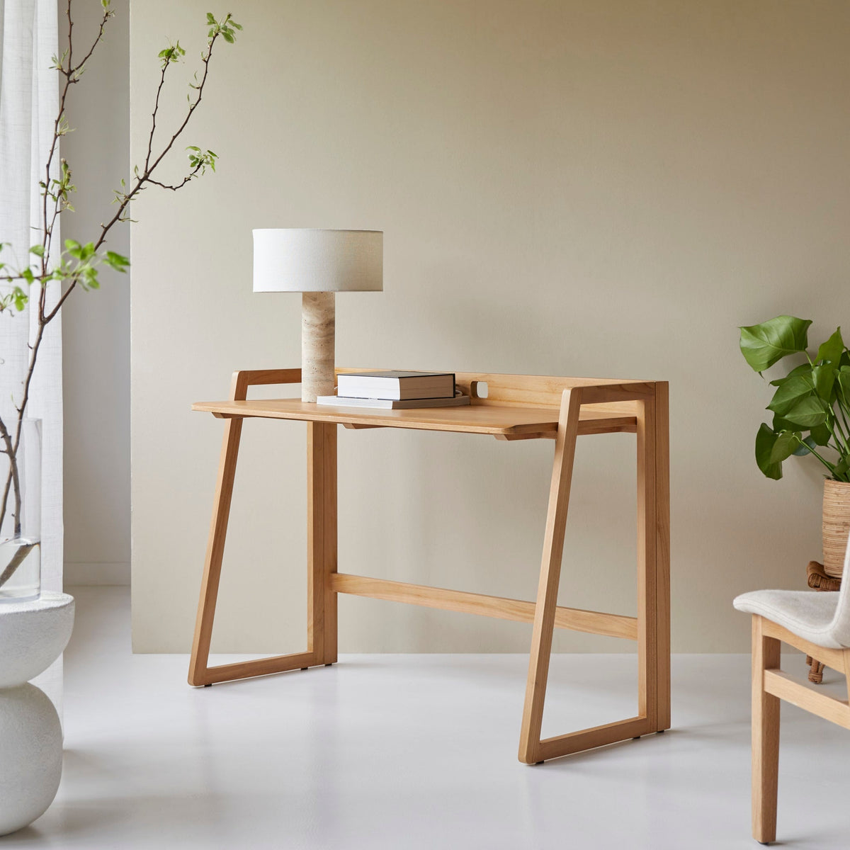 Tikamoon Philip foldable desk in solid teak, angled view