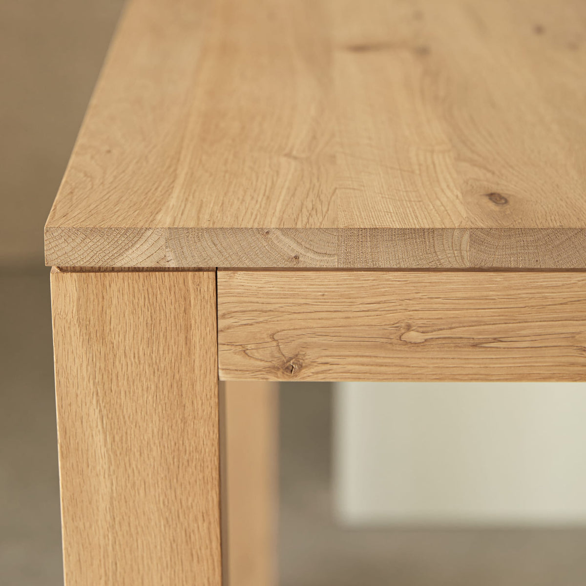 Tikamoon Eden extendable dining table in solid oak, angled view