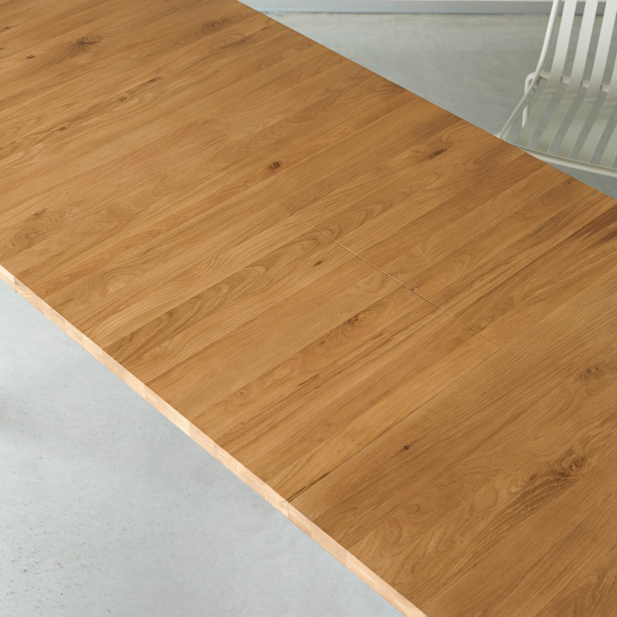 Tikamoon Maia oak dining table, detail of the extension leaf