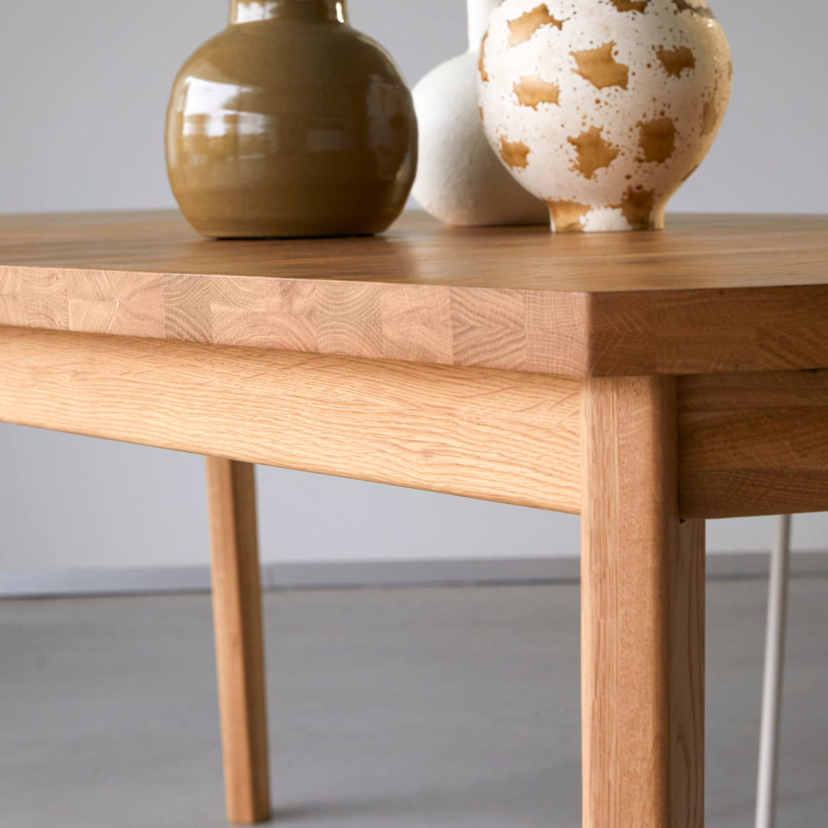 Tikamoon Maia oak dining table, view of the base and legs