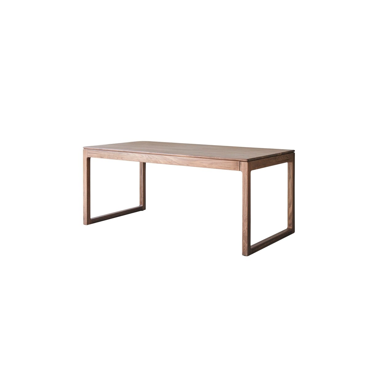 Tikamoon Arto extendable dining table in solid walnut, styled in a room with natural light