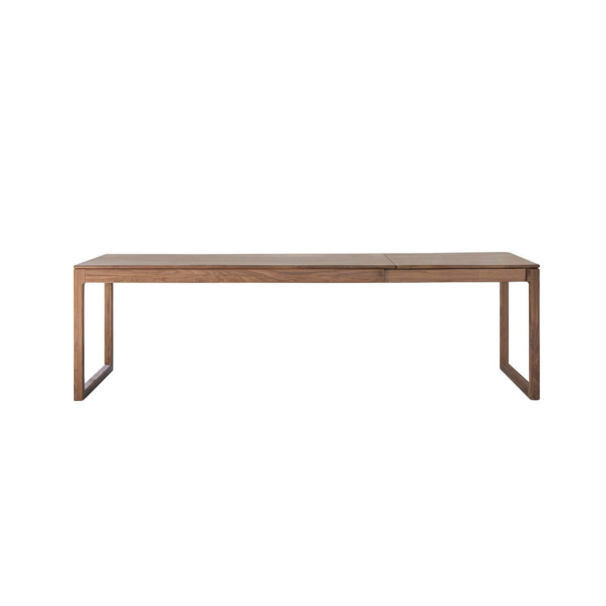 Tikamoon Arto extendable dining table in solid walnut, styled in an open-plan dining space