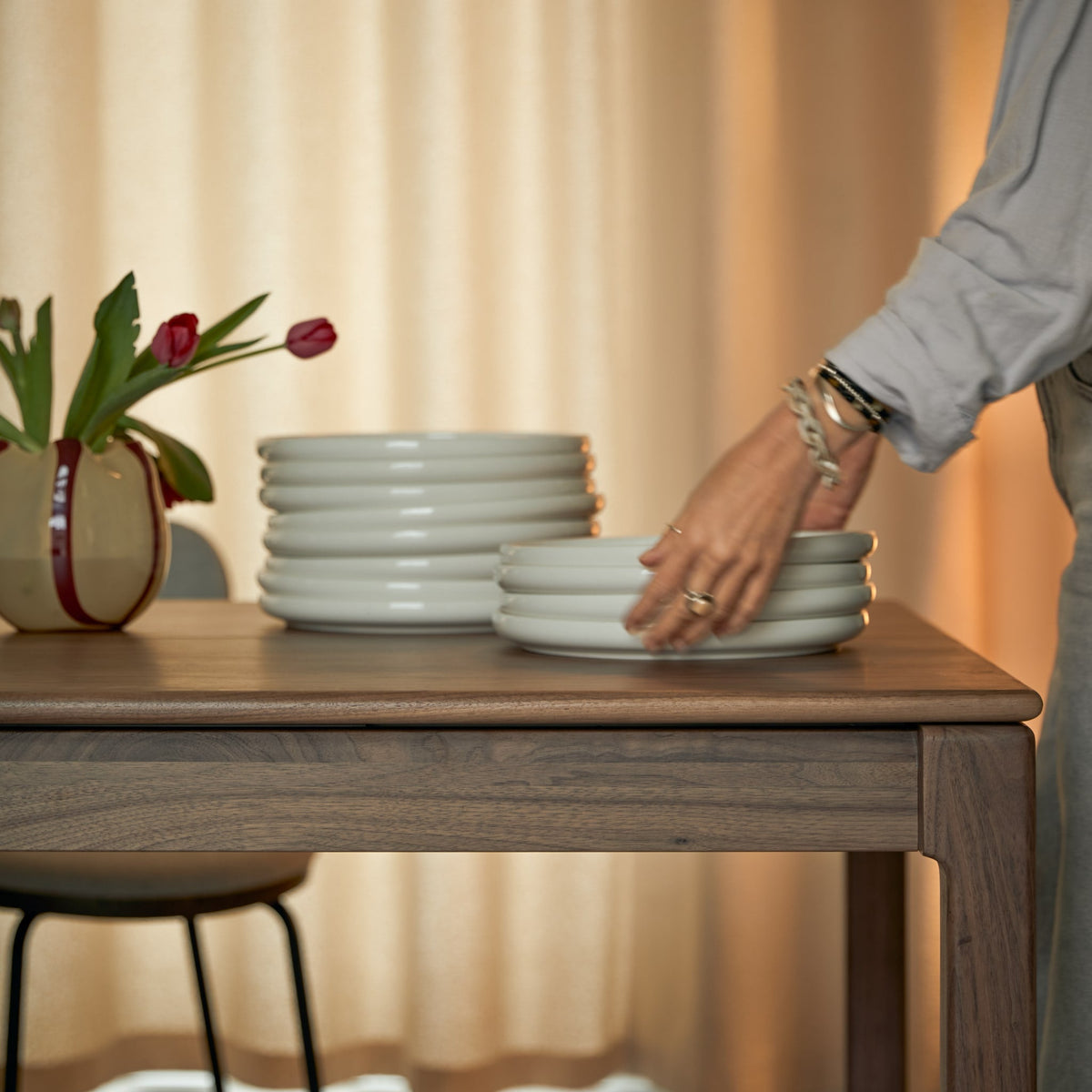 Tikamoon Arto extendable dining table in solid walnut, top-down view of the surface