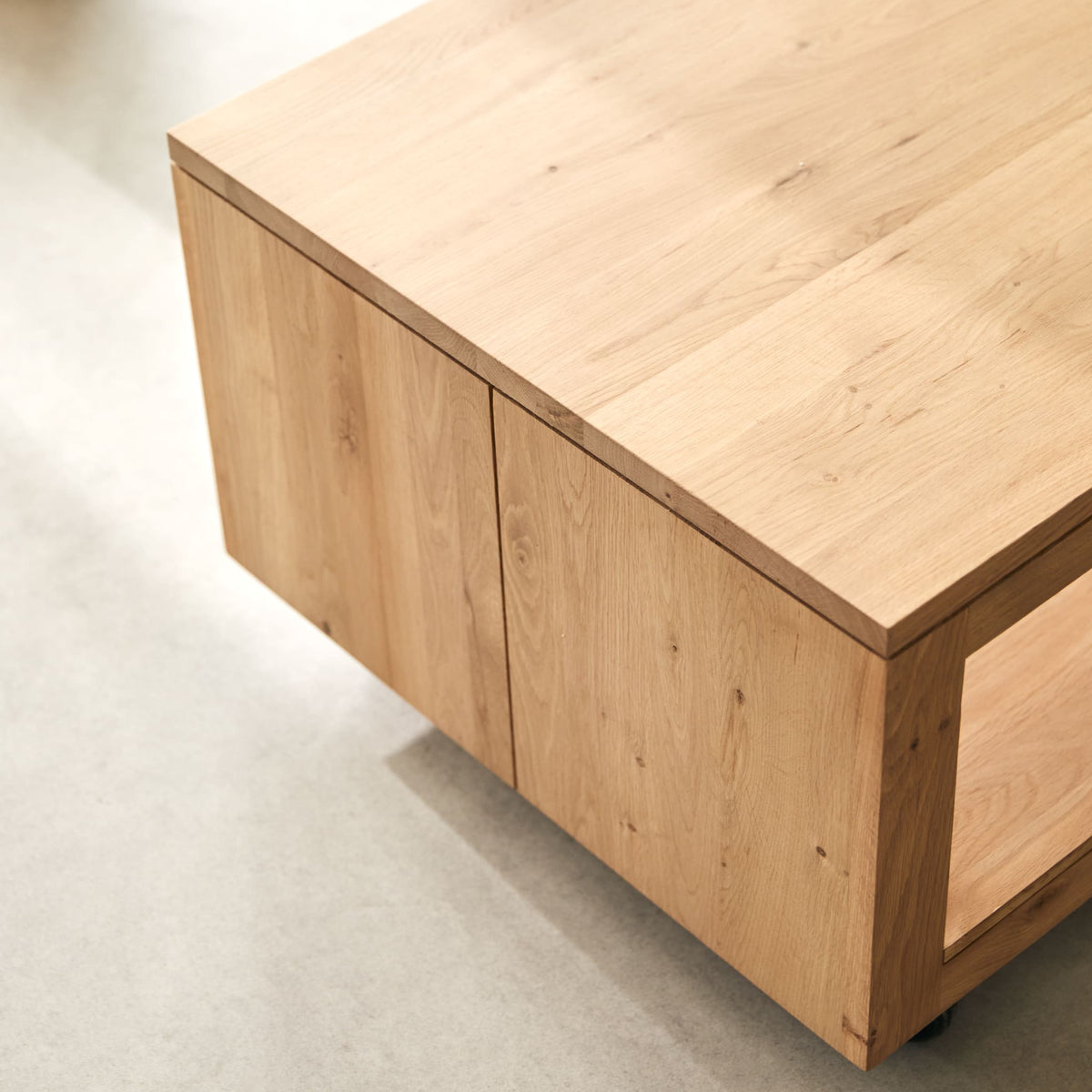 Tikamoon Anoa rectangular coffee table in solid oak, close-up of a caster