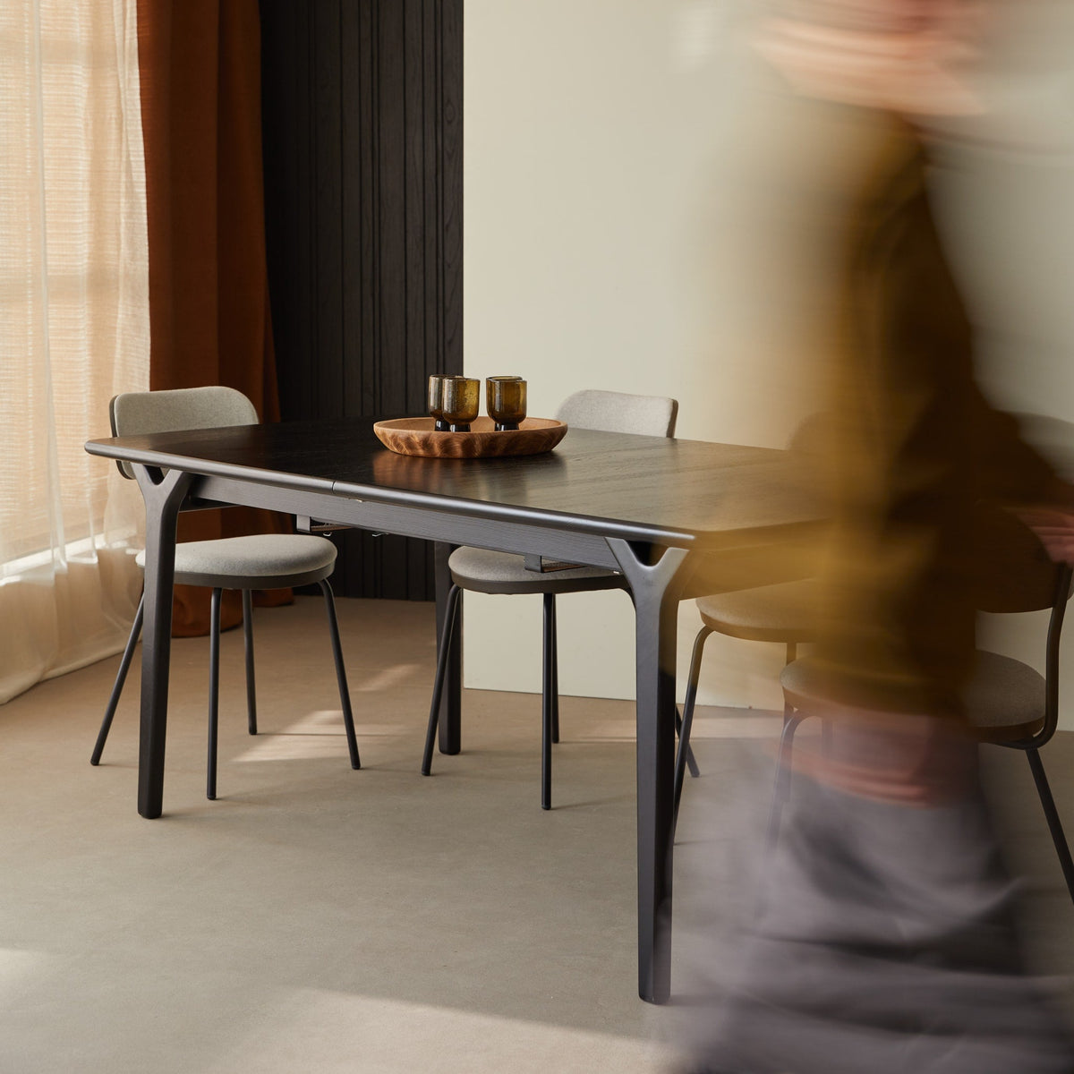 Tikamoon Clara black oak dining table closed, seating six