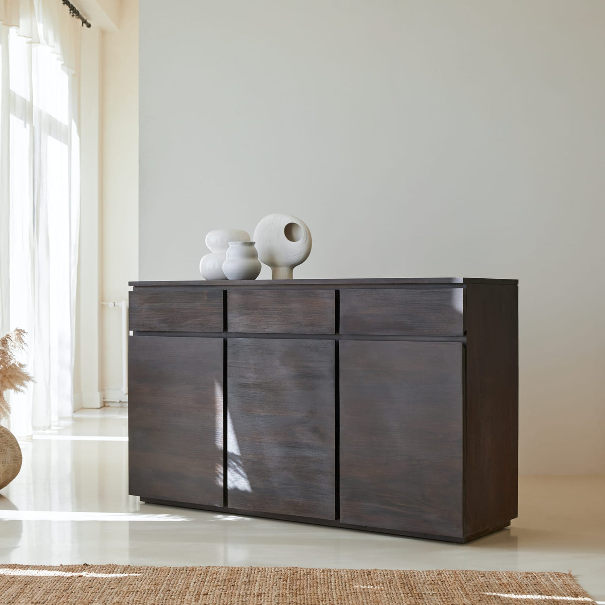 Tikamoon Eva sideboard in solid mahogany, three-quarter view