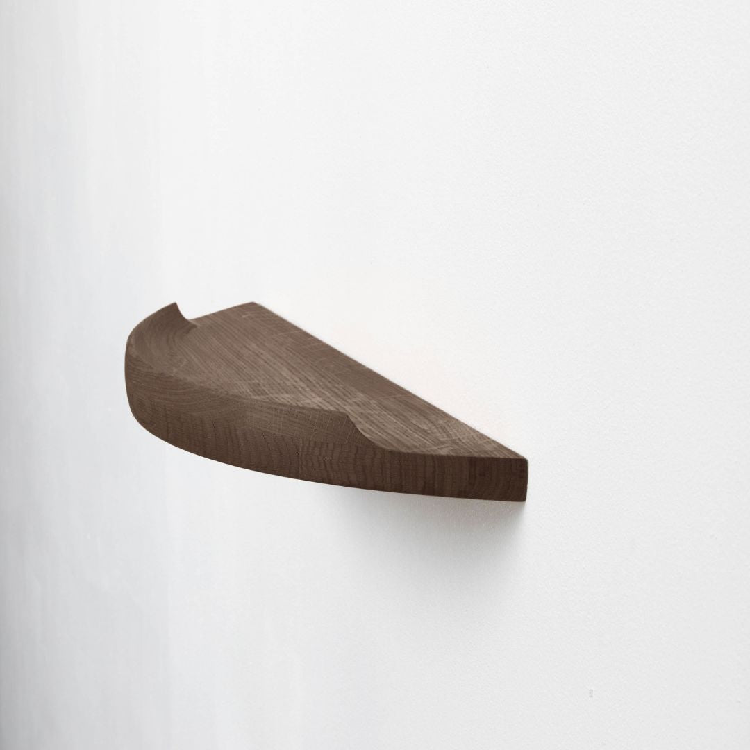 Aakjaer Arcus Shelf Small in smoked oak, a 23.6 in floating solid oak wall shelf