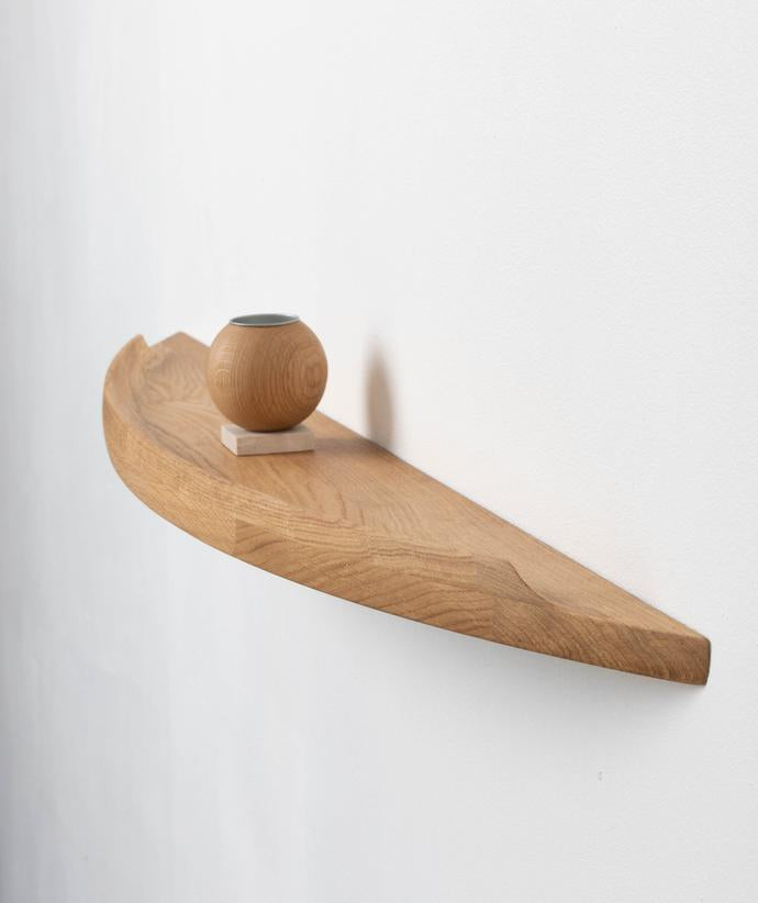 Aakjaer Arcus Shelf Large in natural oiled oak with a round oak vase on top