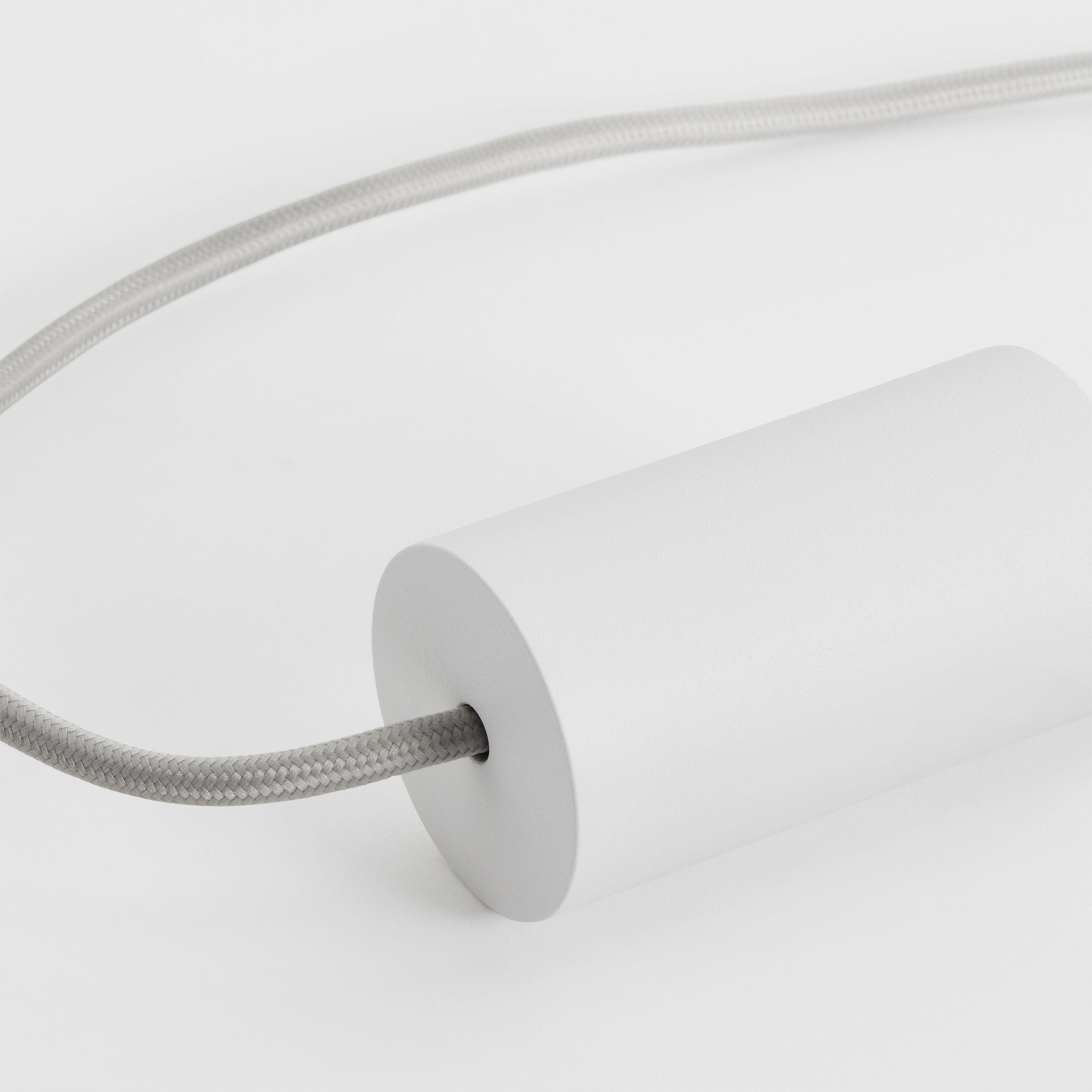 Alumina Triple Pendant by Tala, angled view of the Chalk finish texture