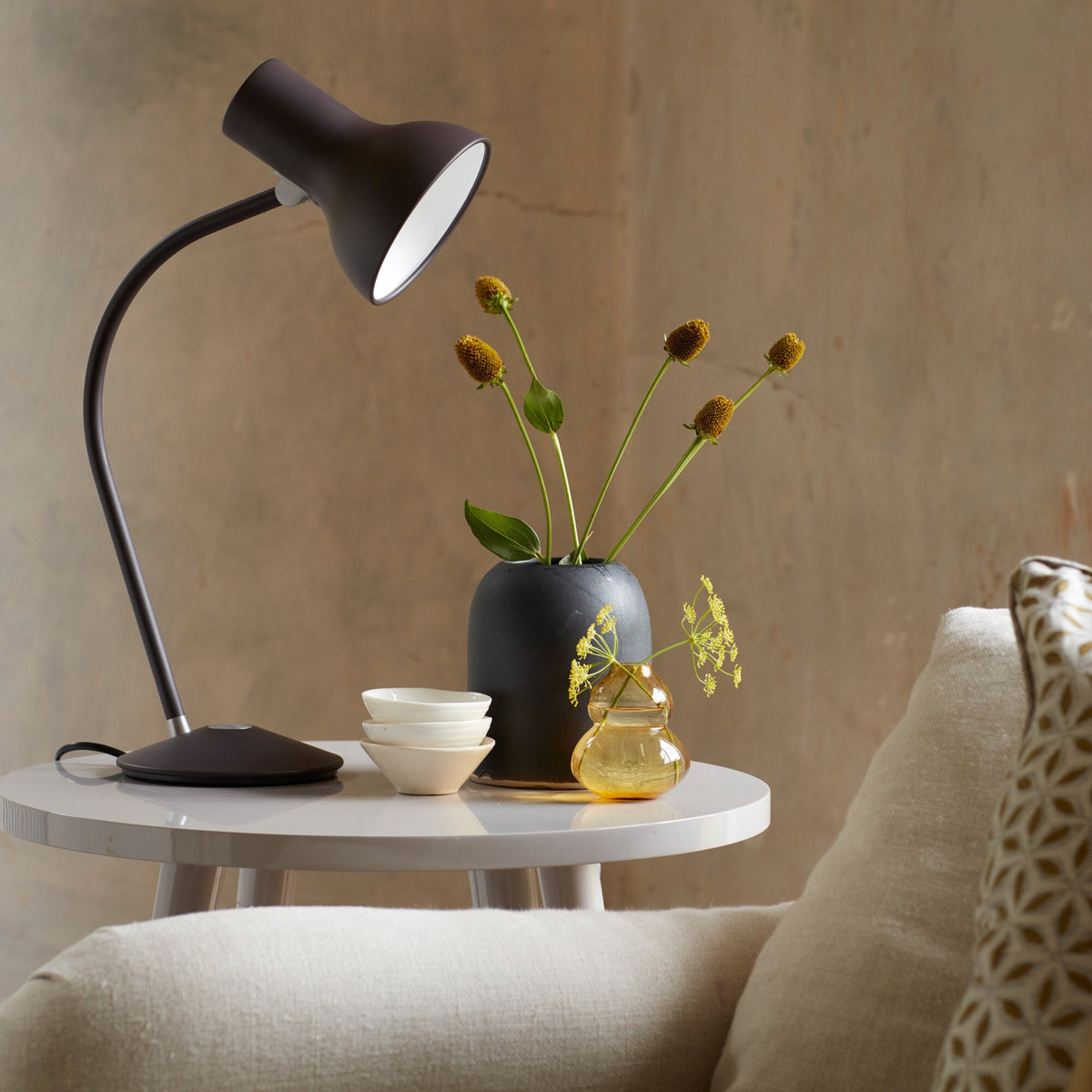 Anglepoise Type 75 Mini table lamp in Black Umber on a round white side table