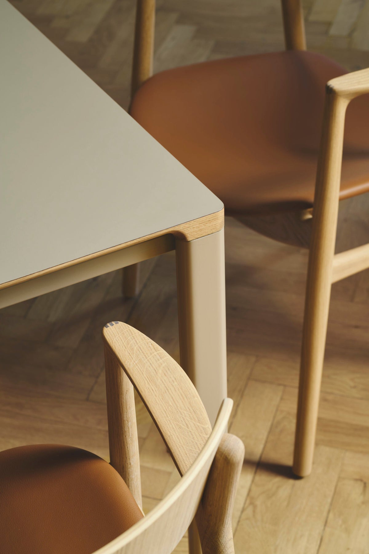 Bent Hansen Asger Dining Chair in oiled oak, cognac leather seat, styled in an interior setting, oak and leather