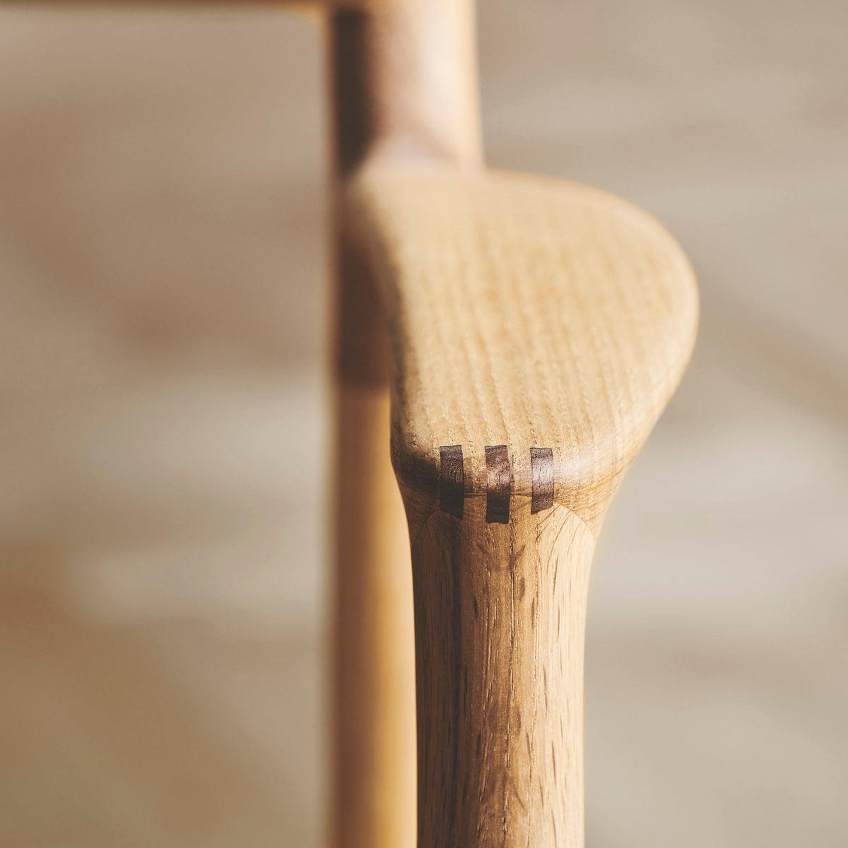 Detail of Bent Hansen Asger Dining Chair showing the armrest joint