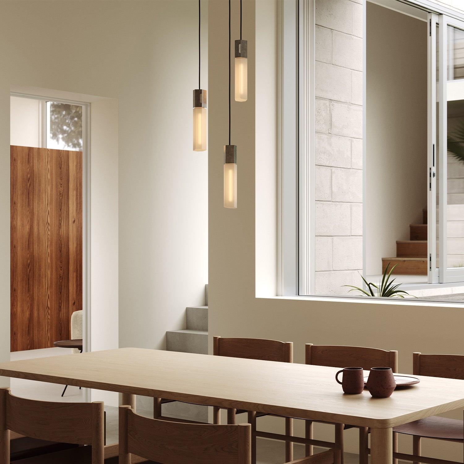Basalt Triple Pendant by Tala in Stainless Steel, underside view of the glass bulbs