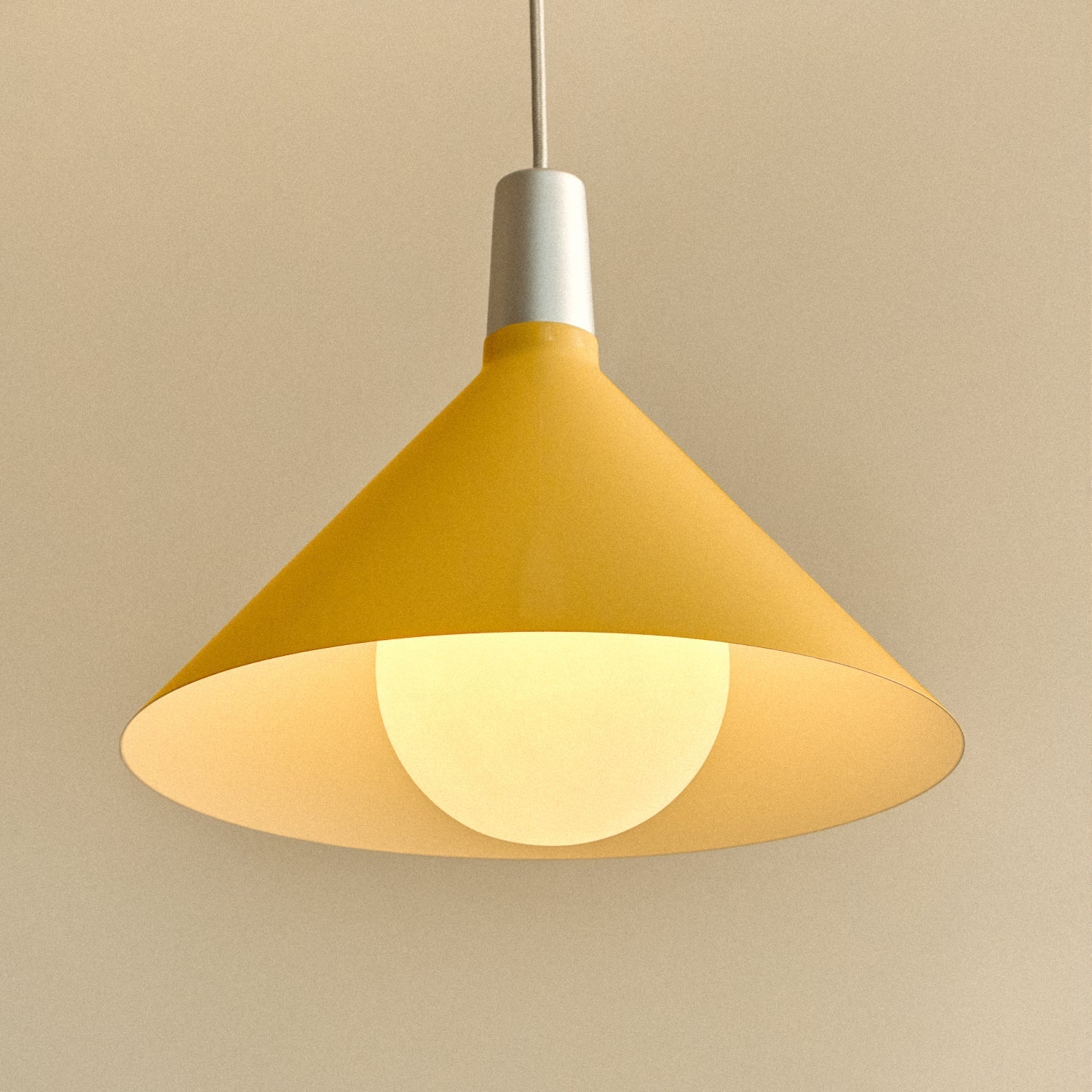 Tala Bower pendant light, medium, Yellow — interior of the spun-aluminium shade