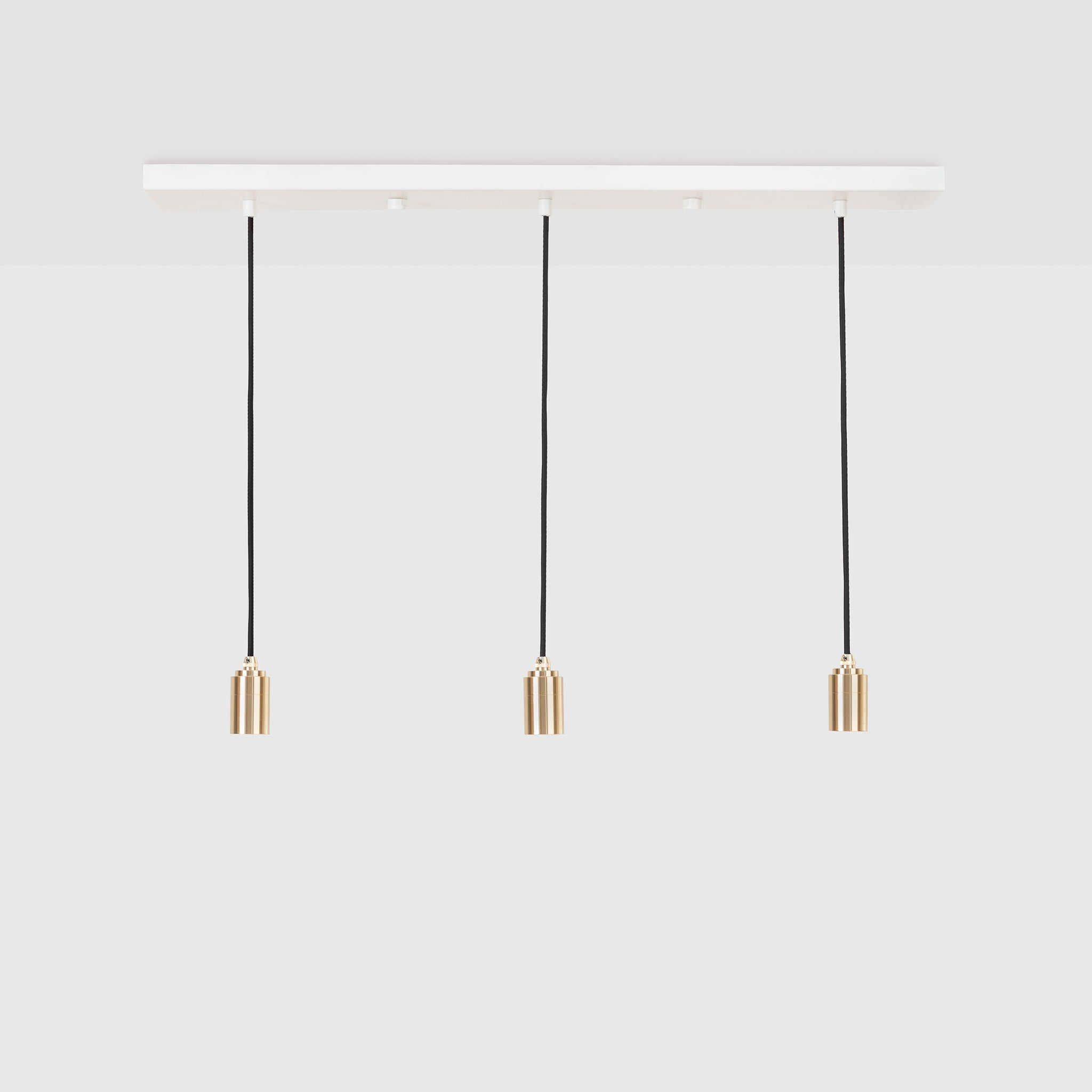 Tala Linear Triple Pendant in Brass, Bare variant, product shot on a plain grey background