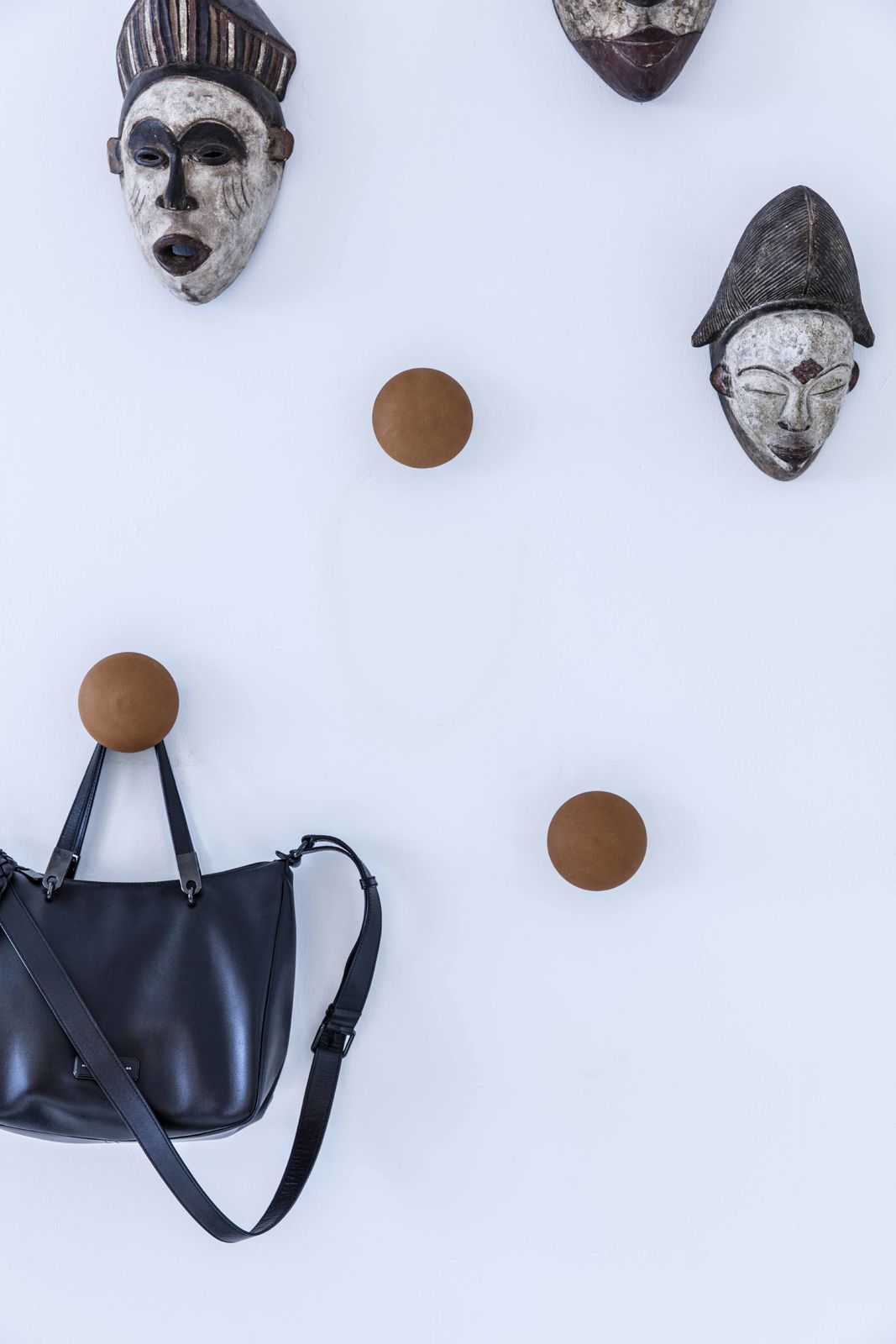 Bent Hansen Button-Up Wall Hook in cognac leather, styled in an interior setting, leather
